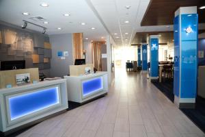 a hospital lobby with blue screens on the walls at Holiday Inn Express & Suites - Wylie West by IHG in Wylie +68 photos