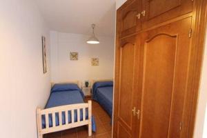 Posteľ alebo postele v izbe v ubytovaní Casa María en el centro Nerja