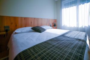 Postel nebo postele na pokoji v ubytování The Lion's Den BnB