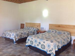 מיטה או מיטות בחדר ב-Hotel Finca Las Bovedas