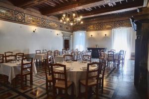 a large room with tables and chairs in it at Hotel Villa Ciconia in Orvieto