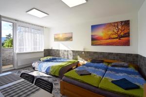 Postel nebo postele na pokoji v ubytování Apartman Nikola Trojanovice
