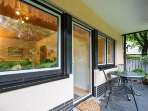 a patio with a table and a window at Holiday home in Kyllburg Eifel near the forest in Kyllburg