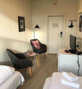 Postel nebo postele na pokoji v ubytování Ami Hotel