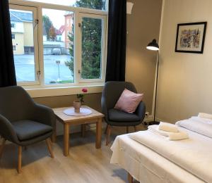 Postel nebo postele na pokoji v ubytování Ami Hotel