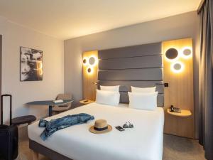 Postel nebo postele na pokoji v ubytování Novotel Brussels Centre Midi