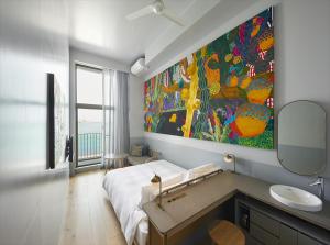 HOTEL ANTEROOM NAHA客房内的一张或多张床位