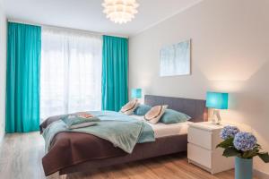 Łóżko lub łóżka w pokoju w obiekcie AbsyntApartments 24 Rynek Wrocław