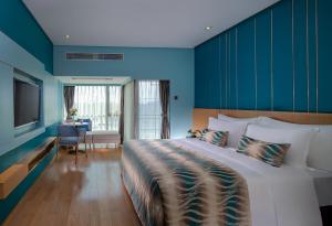 Posteľ alebo postele v izbe v ubytovaní Sentosa Hotel Apartment Taoyuan Branch