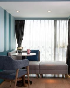 Posedenie v ubytovaní Sentosa Hotel Apartment Taoyuan Branch