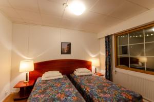 Una cama o camas en una habitación de Lokkankoti A