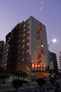 a tall building with a lot of windows at LYNQ AERO in Kolkata