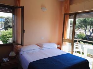 Postel nebo postele na pokoji v ubytování Hotel Elizabeth