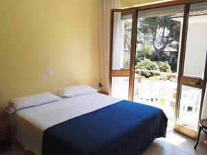 Postel nebo postele na pokoji v ubytování Hotel Elizabeth