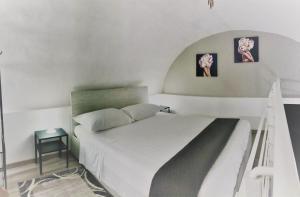 Postel nebo postele na pokoji v ubytování La Casa di Karola