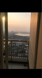 a view of the ocean from a balcony of a building at 2 BR Jungle Decor Beautiful Sea View Fast Internet Top Of The Mall in Jakarta