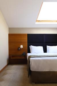 Postel nebo postele na pokoji v ubytování Riva Reşatbey Luxury Hotel