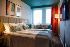 Postel nebo postele na pokoji v ubytování Quality Hotel Prinsen