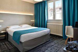 Postel nebo postele na pokoji v ubytování Hôtel Fesch & Spa + 37 fotografií