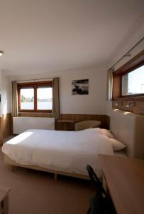 Ένα ή περισσότερα κρεβάτια σε δωμάτιο στο Hotel Chamdor