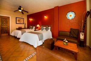 Postel nebo postele na pokoji v ubytování La Casona Tequisquiapan Hotel & Spa + 37 fotografií