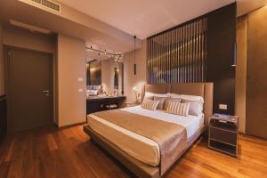 Postel nebo postele na pokoji v ubytování Callistos Hotel & Spa
