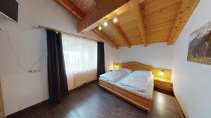 Posteľ alebo postele v izbe v ubytovaní Appartement Kitzsteinhorn -Summercard included
