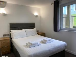 Кровать или кровати в номере North Devon Resort