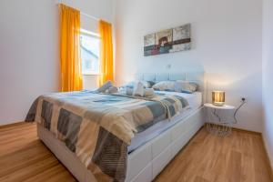 Postel nebo postele na pokoji v ubytování Apartments BARBARA 2