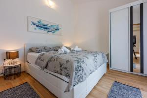 Postel nebo postele na pokoji v ubytování Apartments BARBARA 2