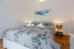Postel nebo postele na pokoji v ubytování Apartments BARBARA 2