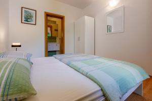 Postel nebo postele na pokoji v ubytování Apartments BARBARA 3