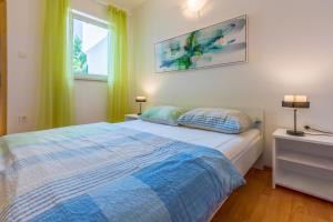 Postel nebo postele na pokoji v ubytování Apartments BARBARA 3