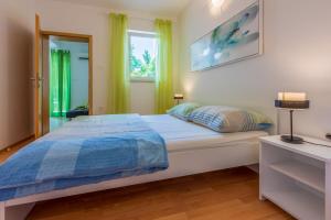 Postel nebo postele na pokoji v ubytování Apartments BARBARA 3