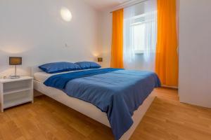 Postel nebo postele na pokoji v ubytování Apartments BARBARA 3