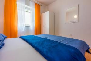 Postel nebo postele na pokoji v ubytování Apartments BARBARA 3