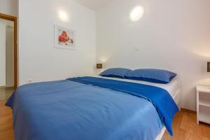 Postel nebo postele na pokoji v ubytování Apartments BARBARA 3