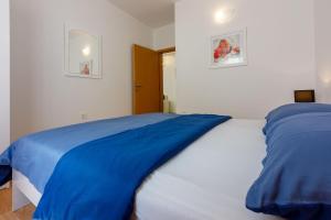 Postel nebo postele na pokoji v ubytování Apartments BARBARA 3