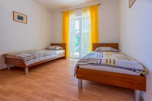 Postel nebo postele na pokoji v ubytování Apartments BARBARA 3