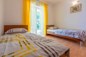 Postel nebo postele na pokoji v ubytování Apartments BARBARA 3