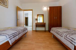 Postel nebo postele na pokoji v ubytování Apartments BARBARA 3