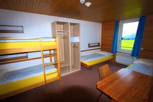Postel nebo postele na pokoji v ubytování juhui Lenzerheide