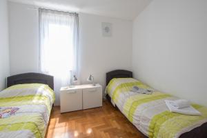 Postel nebo postele na pokoji v ubytování Villas Faro