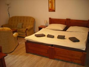 A bed or beds in a room at Pension Relax