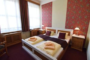 Posteľ alebo postele v izbe v ubytovaní Hotel Soudek