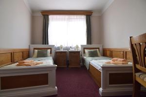 Posteľ alebo postele v izbe v ubytovaní Hotel Soudek