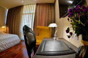 Postel nebo postele na pokoji v ubytování La Bohème Hotel
