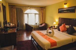 Postel nebo postele na pokoji v ubytování Hotel The Kantipur