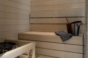 a room with a wooden wall and a wooden shelf at Lapland Hotels Bulevardi in Helsinki