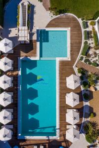 an overhead view of a swimming pool at a resort at Lagaria Apartments in Afitos